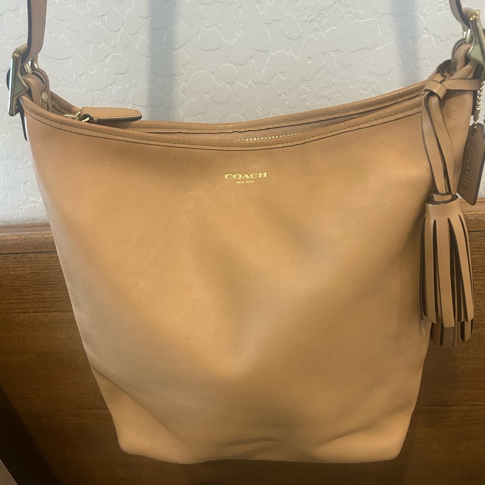 Coach Vintage Tan Leather Zip Up Hobo Bag with Tassels & Brass Hardware.